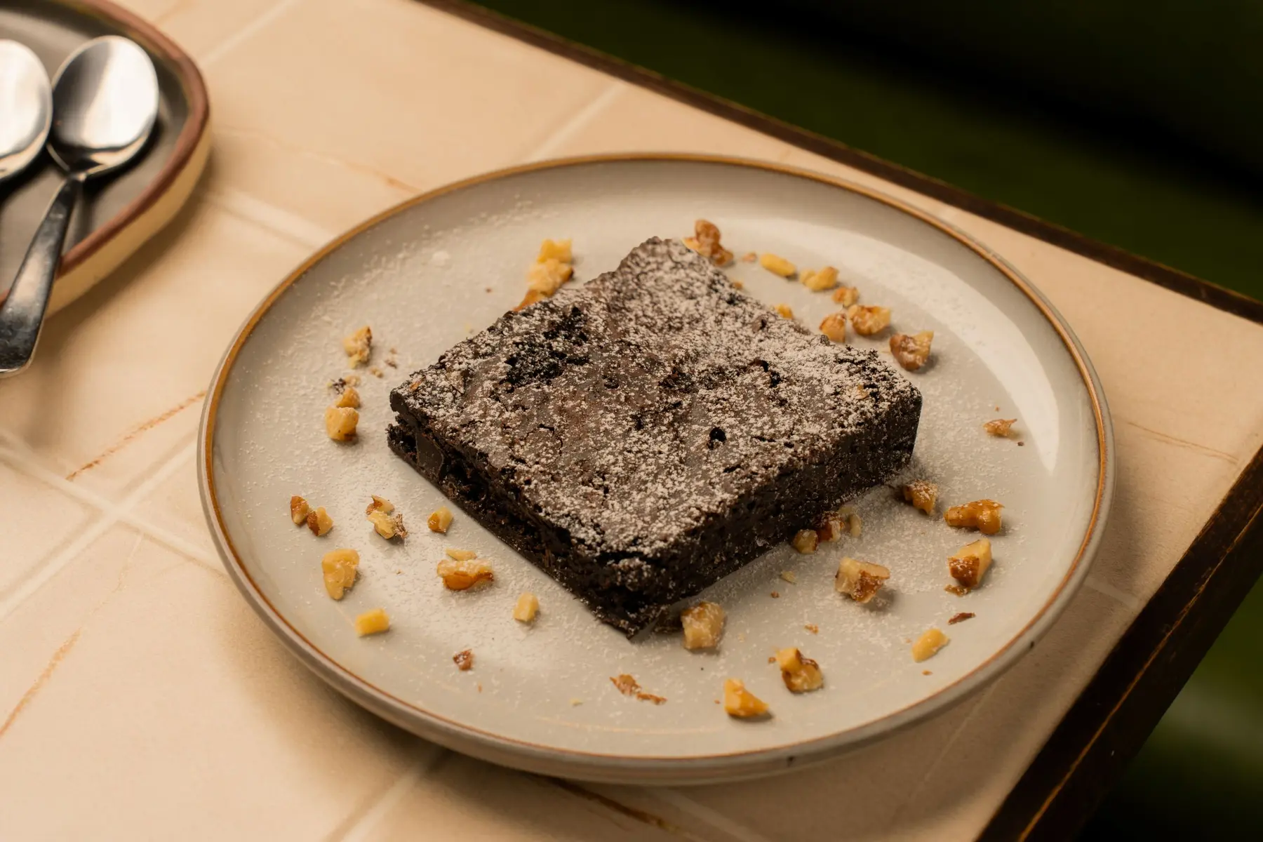 A rich brownie plated for dessert