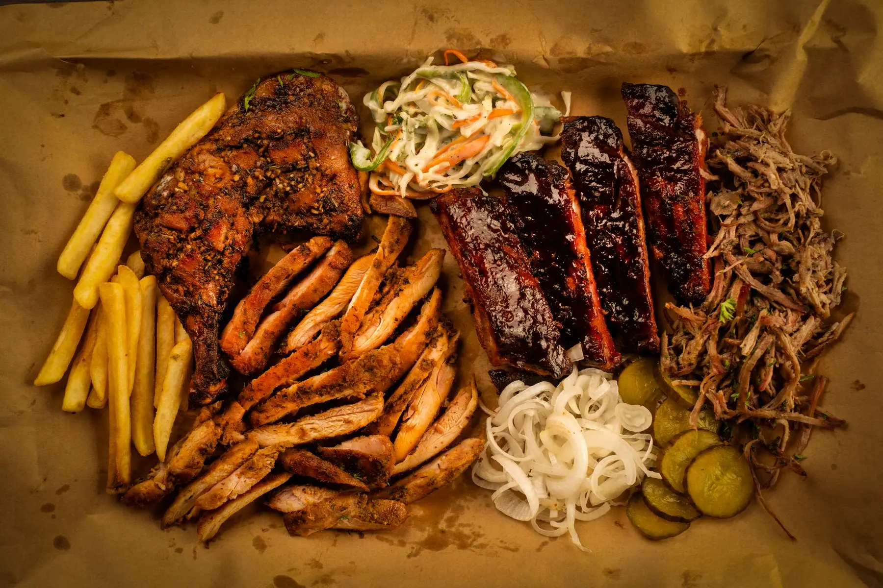 A generous platter of grilled food and sides