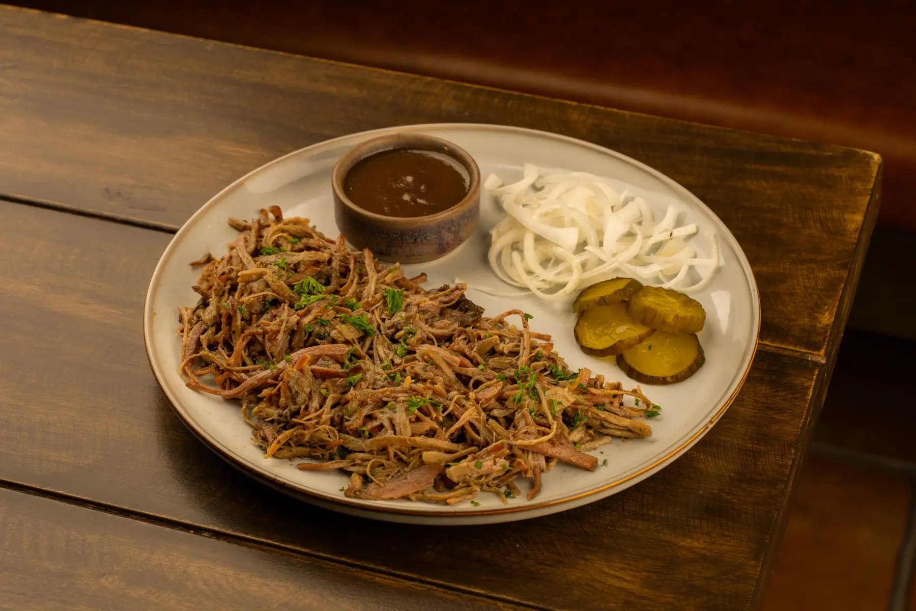 A comforting pulled meat plate with sides